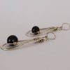 Pendientes plateados de gota doble con obsidiana en el centro